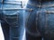 Close up of many blue jeans on women mannequin