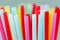 Close-up of many multicolored straws for cocktails. Macro