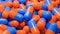 Close up of many orange and blue pills capsules. Medicine and pharmacy concept.,3d model and illustration