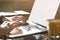 Close-up of manâ€™s hands on laptop keyboard. Guy using computer sitting in cafe having coffee. Space for design layout mockup