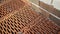 Close-up masonry of red brick blocks in process of construction. Stock footage. Red ceramic brick blocks for building