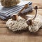 Close-up on massage accessory and natural sponge on wood background for relaxation