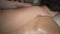 Close-up massage with body scrubbing. Action. Professional masseur scrubs woman`s back. Scrubbing treatments to