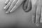 Close up of masseur hands; monochrome