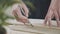 Close-up of a master potter, clay cutting special tool. Pottery and ceramic.