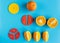 Close up mathematical fractions and oranges as a sample of parts on blue background. Creative, fun mathematics banner. Education