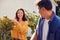 Close Up Of Mature Asian Couple At Work Watering And Pruning Plants In Garden At Home