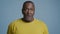 Close-up mature athletic african american man in studio gray background exhale after hard workout sporty male middle