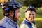 Close up of mature couple holding cycling helmet