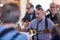 Close up of mature male musician passionately singing and playing ukelele inside a bar in Garachico, Tenerife, Spain