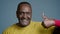 Close-up mature sporty african american man posing in studio gray background sportive male athlete sport trainer showing