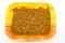 Close up mealworm feed for animals in orange tray isolate on white background