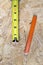 Close up of measuring tape and pencil