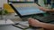 Close up of media specialist hands using graphic tablet