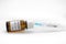 Close-up medical syringe with a vaccine. Vaccine ampoule full of anti-virus medicine, ready for vaccination. A coronavirus