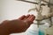 Close up of a medical worker in protective clothing washing her hands