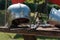 Close up of Medieval Silver Helmet on Wooden Table with Knight`s Garment