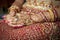 Close up of Mehndi tattoos on the hands of a Hindu or Sikh bride i