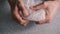 Close up of men hands playing with plastic  bubble wrap.