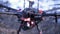 Close-up of men prepared quadcopter for flight. Clip. Two men admire latest version of quadcopter with powerful motors