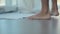 Close-up of men\'s feet going barefoot on a floor