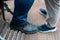 Close up Men`s feet wearing leather shoes, which are safety shoes with steel inside to prevent injuries in construction site work