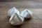 Close-up of meringue on a table. Marshmallows on wooden background.