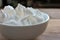 Close-up of meringue on a table. Marshmallows on wooden background.