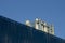 Close up metal chimneys on the factory roof.