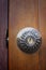 Close up metal door knob open house on a old wooden door