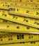 Close up of metal yellow measuring tapes