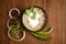 Close-up of Methi-Matar-Malai with white curry with fresh green chilies, mint leaves, and onions. A popular, delicious Indian