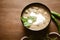 Close-up of Methi-Matar-Malai with white curry with fresh green chilies, mint leaves, and onions. A popular, delicious Indian