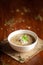 Close-up of Methi, matar malai with white curry. A popular, delicious Indian recipe in white ceramic bowl.