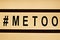 Close up of ` METOO` text in lightbox. Female empowering educational movement.