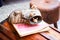 Close-up mice and brown shoes on wooden chest. Mouse sleeping in old torn brown shoe. Figurines in street market