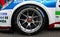 Close up of Michelin slick racing tire on Porsche Carrera car, side view motorsport
