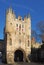 A close up of the of Micklegate Bar the 12 century gatehouse and southern entrance to the city of york with a cyclist passing