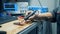 Close up of a microchip getting brazed by a worker with prosthetic hands