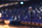 Close up of microphone over abstract blurred of attendee in seminar room or conference hall