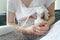 Close up on midsection of unknown caucasian woman holding baby bottle and breast pump pumping milk for her baby - parenthood and