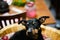 Close up of miniature pinscher head with ears up Canis lupus familiaris, mini doberman. Dog is sitting in a basket