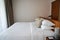 Close up minimal double bed with white mattress in luxury hotel bedroom for honeymoon in holidays