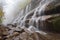 close-up of misty cascading waterfalls, with droplets of water visible