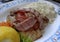 Close up of Mixed grilled pork and chicken meat platter with lemon, white rice for side dish, aegean, greek, mediterranean food