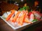 Close-up of mixed Sashimi set Japanese food on white plate.