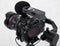 Close up of modern dslr camera on 3-axis gimbal stabilizer with microphone recorder over gray