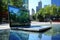 Close-up of modern laptop on sleek desk with urban cityscape in the background.