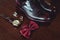 Close up of modern man accessories. wedding rings, cherry bowtie, leather shoes, watch and cufflinks
