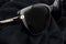 Close up of a modern sunglasses on sexy black background